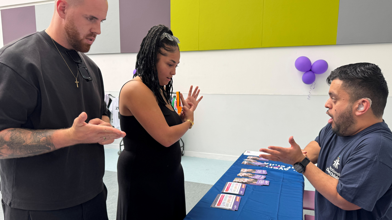Osman from Deaf Services teaching finger spelling at our charity Zumbathon for Deaf children