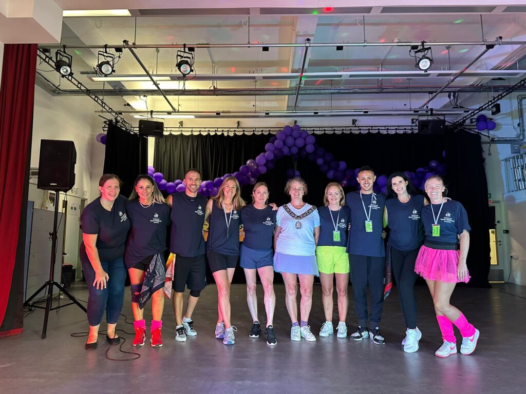 Town of Chesham, Mayor joins the dancers and BSL interpreter on stage for our charity Zumbathon for Deaf children. 
