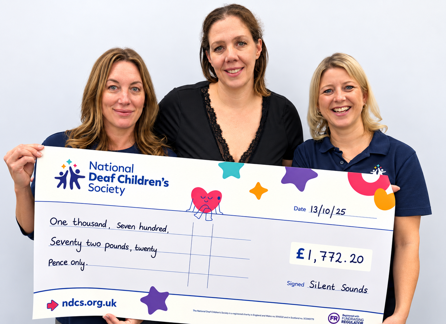 The team present charity cheque for the National deaf Children's Society